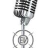 An image of an old-fashioned microphone with an EVstudio logo on the stem.