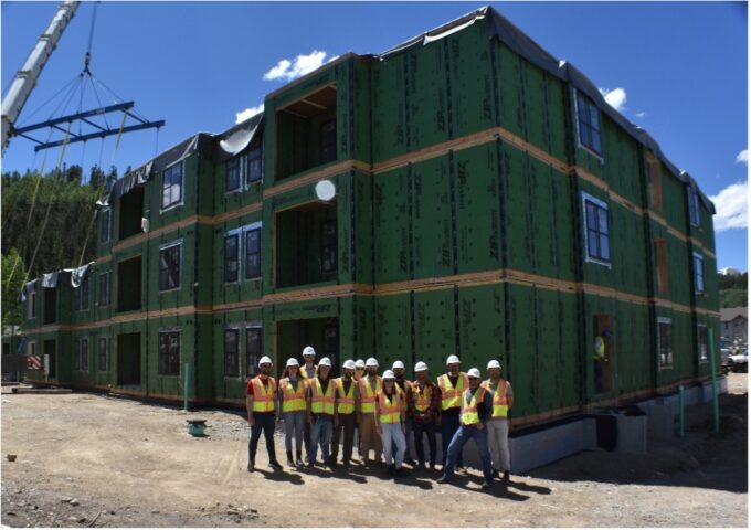 The EVstudio EVolution Design Studio team in front of the Justice Center Apartments in Breckenridge, CO.