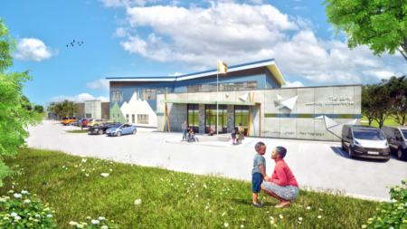 Exterior rendering of TLC Early Learning Collaborative - features grey fiber cement panels and blue and green stucco that echoes the surrounding mountains. A butterfly roof adds a unique and exciting element for students and staff alike.