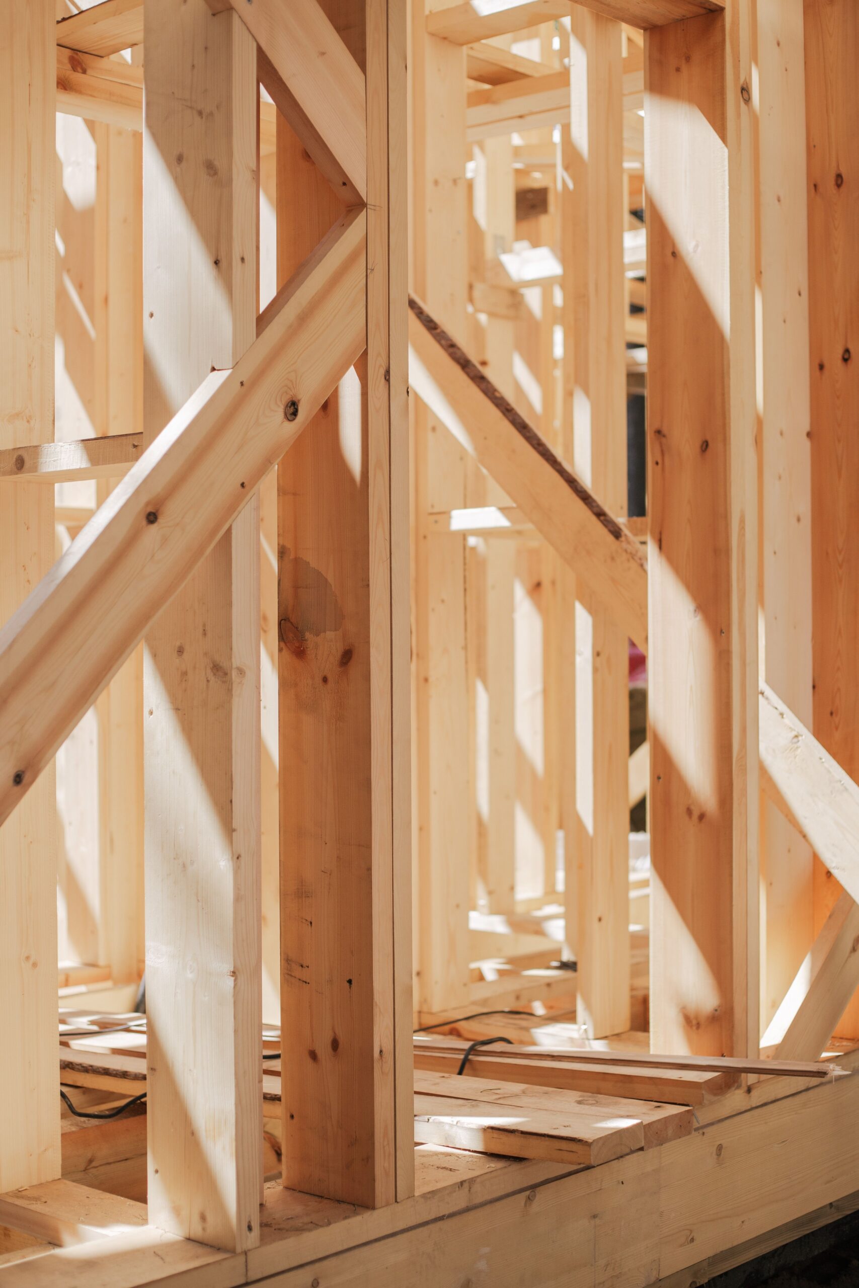Close-up of wood stud framing and diagonal bracing used in residential shear wall construction
