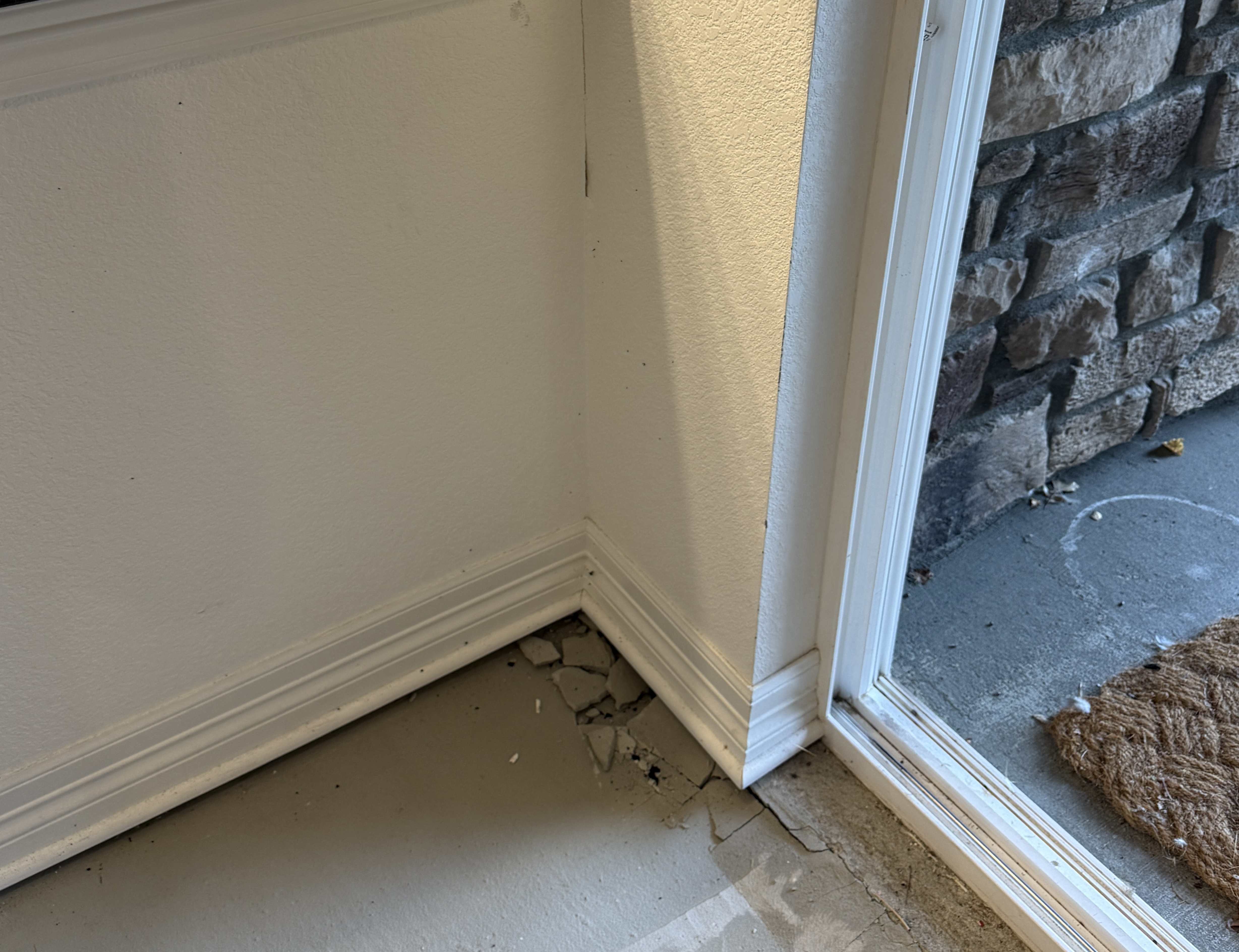 Basement slab movement observed during a field assessment.