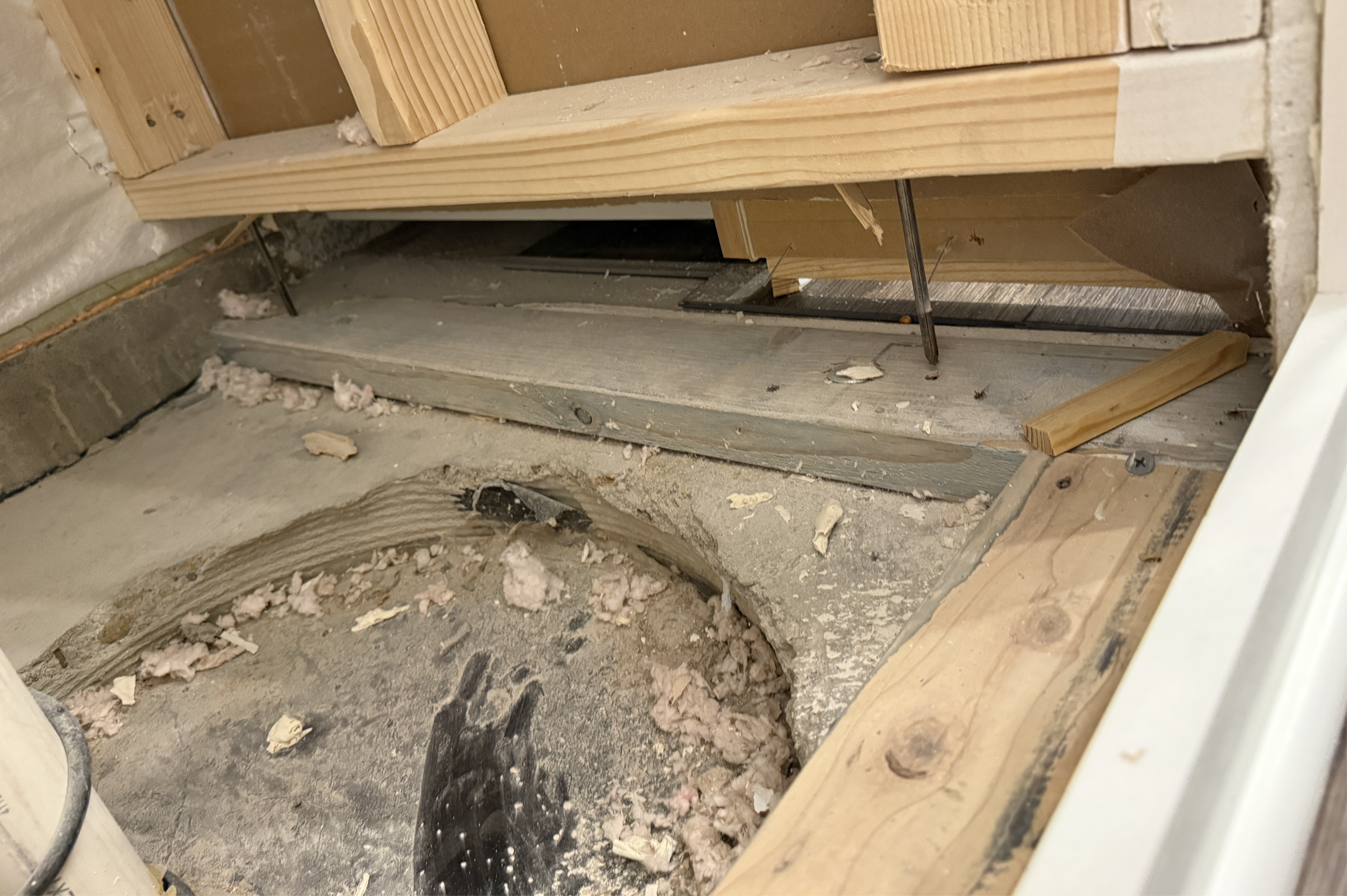 Exposed floating wall framing in a finished basement.